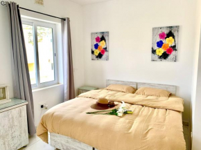 Private bedroom with balcony in a shared apartment at the Bay of Xlendi